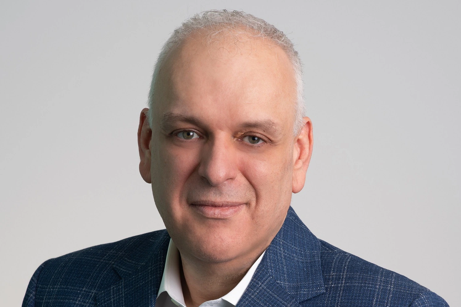 Head-and-shoulders portrait of Theo Panagiotoulias, CEO of Star Alliance, in a blue blazer against a plain light backgro