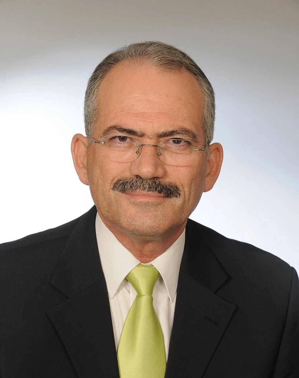 Portrait photo of Kypros Nicolaides in a suit and tie